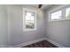 Bright bedroom with two windows, ceiling fan, and neutral walls at 508 East End Ave, Durham, NC 27703