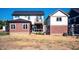 Two-story house back with a deck, additional building, and large yard at 508 East End Ave, Durham, NC 27703