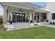 Home exterior showcasing a large patio and landscaped yard at 3300 Founding Place, Raleigh, NC 27612