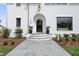 Elegant home exterior with a welcoming front entry and landscaping at 3300 Founding Place, Raleigh, NC 27612