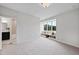 Comfortable bedroom with built-in window seat and en-suite bathroom access at 3300 Founding Place, Raleigh, NC 27612