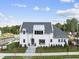Two-story white house with gray roof, landscaping, and walkway at 3300 Founding Place, Raleigh, NC 27612