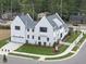 Two-story house with attached garage and front yard landscaping at 3300 Founding Place, Raleigh, NC 27612