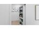 Hidden bookcase with plants and decorative items at 3300 Founding Place, Raleigh, NC 27612