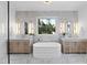 Elegant bathroom with marble finishes, a free-standing tub, and dual vanities at 3300 Founding Place, Raleigh, NC 27612