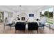 Bright living room with hardwood floors, fireplace and large windows at 3300 Founding Place, Raleigh, NC 27612