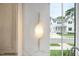 Stylish gold light fixture adds a touch of elegance to the kitchen at 3300 Founding Place, Raleigh, NC 27612
