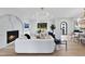 Open living room with marble fireplace and hardwood floors at 3300 Founding Place, Raleigh, NC 27612