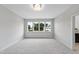 Spacious bedroom with grey carpeting and large windows offering natural light at 3300 Founding Place, Raleigh, NC 27612