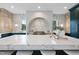 Modern kitchen with marble countertops and dark green cabinets at 3300 Founding Place, Raleigh, NC 27612