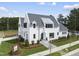 Stunning two-story home with white exterior and gray roof at 3300 Founding Place, Raleigh, NC 27612