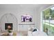 Living room features a marble fireplace and large window at 3300 Founding Place, Raleigh, NC 27612