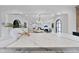 Kitchen island with marble countertop, overlooking dining area at 3300 Founding Place, Raleigh, NC 27612