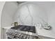 Modern gas cooktop with marble backsplash at 3300 Founding Place, Raleigh, NC 27612