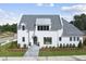 Stunning two-story home with white exterior and gray roof at 3300 Founding Place, Raleigh, NC 27612
