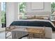 Spacious bedroom with a large bed and natural light at 3300 Founding Place, Raleigh, NC 27612