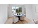 Round table with four chairs in a bright sitting area at 3300 Founding Place, Raleigh, NC 27612