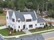 Two-story white house with gray roof, landscaping, and driveway at 3300 Founding Place, Raleigh, NC 27612