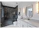 Elegant bathroom with marble shower, white vanity, and modern fixtures at 3300 Founding Place, Raleigh, NC 27612
