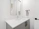 Modern bathroom with a sleek floating vanity and a large mirror at 2119 Brewer St, Raleigh, NC 27608