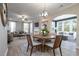 Open concept dining area overlooking living room and sunroom at 200 Berry Mill Ln # 153, Raleigh, NC 27603