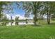 Serene view of a pond surrounded by lush greenery at 576 Barbour Farm Ln, Four Oaks, NC 27524