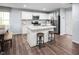 Modern kitchen with island, stainless steel appliances, and light wood flooring at 524 Camaro Rift Trl, Wendell, NC 27591