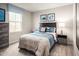 Well-lit bedroom featuring a full-size bed and themed decor at 524 Camaro Rift Trl, Wendell, NC 27591