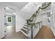 Grand staircase with hardwood floors and a view of other rooms at 2009 St Marys St, Raleigh, NC 27608