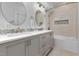 Modern bathroom with double sinks and a walk-in shower at 427 Cliffdale Rd, Chapel Hill, NC 27516