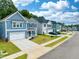 Street view of charming homes in a new neighborhood with lush landscaping at 200 Berry Mill Ln # 153, Raleigh, NC 27603