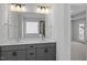 Double vanity bathroom with gray cabinets and quartz countertop at 640 Georgia'S Landing Pkwy # 76, Raleigh, NC 27603