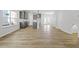 Open floor plan with kitchen, living room and hardwood floors at 640 Georgia'S Landing Pkwy # 76, Raleigh, NC 27603