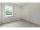 Spacious bedroom with large window and carpeted floor at 226 Moore Creek Dr, Fuquay Varina, NC 27526