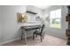 Home office with a desk, chair, and ample natural light at 1577 Ivy Meadow Ln, Zebulon, NC 27597