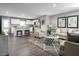 Open-concept living and kitchen area with hardwood floors and stylish decor at 1577 Ivy Meadow Ln, Zebulon, NC 27597