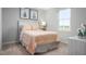 Bright bedroom featuring a comfortable bed and plenty of natural light at 1577 Ivy Meadow Ln, Zebulon, NC 27597