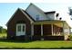 Brick home with a large wrap around porch at 334 Ira B Tart Rd, Dunn, NC 28334