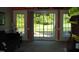 Living room with sliding glass doors leading to a backyard patio at 334 Ira B Tart Rd, Dunn, NC 28334