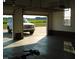 Attached two-car garage with open doors and view of backyard at 334 Ira B Tart Rd, Dunn, NC 28334