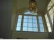 Bright landing area with a large window and a chandelier at 334 Ira B Tart Rd, Dunn, NC 28334