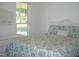 Bedroom with white wicker bed and patterned bedding at 334 Ira B Tart Rd, Dunn, NC 28334