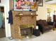 Brick fireplace with TV above in living room at 334 Ira B Tart Rd, Dunn, NC 28334