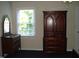 Bright bedroom with wood dresser, vanity, and window at 334 Ira B Tart Rd, Dunn, NC 28334