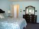 Main bedroom with dresser and ensuite bathroom access at 334 Ira B Tart Rd, Dunn, NC 28334