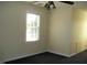 Well-lit bedroom with window and carpet at 334 Ira B Tart Rd, Dunn, NC 28334