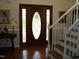 Elegant entryway with hardwood floors, a stained glass door, and a staircase at 334 Ira B Tart Rd, Dunn, NC 28334