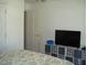 Bedroom with flat screen TV and storage unit at 334 Ira B Tart Rd, Dunn, NC 28334