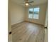 Spacious bedroom with large window and hardwood floors at 6030 Preacher Hayes Rd, Mebane, NC 27302