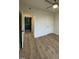 Bright bedroom with hardwood floors and access to hallway at 6030 Preacher Hayes Rd, Mebane, NC 27302